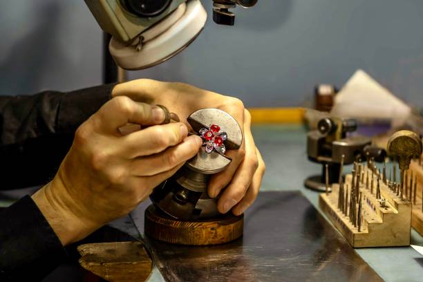 istock Hands of a jeweler with a ring. 1495319093