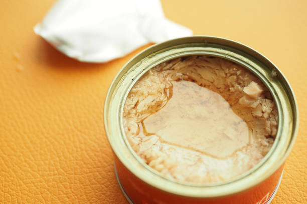 istock canned tuna on wooden table , 1495320704