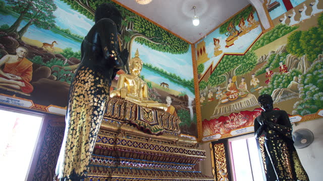 Ancient golden buddha statues in Wat Thai that located in Chachoengsao, Thailand.