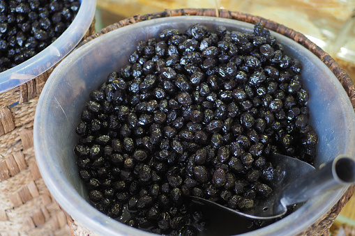 Buckets of olives for sale street food market.