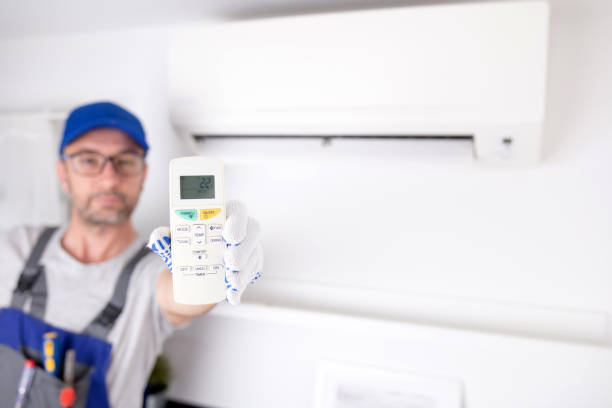 istock Service guy cleaning and maintaining air condition unit. 1495322170