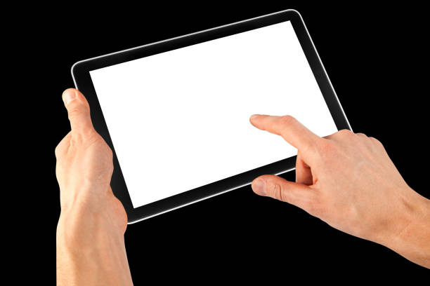 istock a tablet in a hand on the  black backgrounds 1495322319