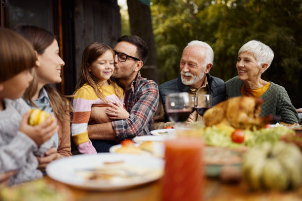 istock Happy extended family enjoying during lunch on a terrace. 1495322780