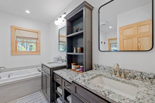 istock Elegantly designed bathroom interior featuring a large vanity, bathtub and sink 1495325048