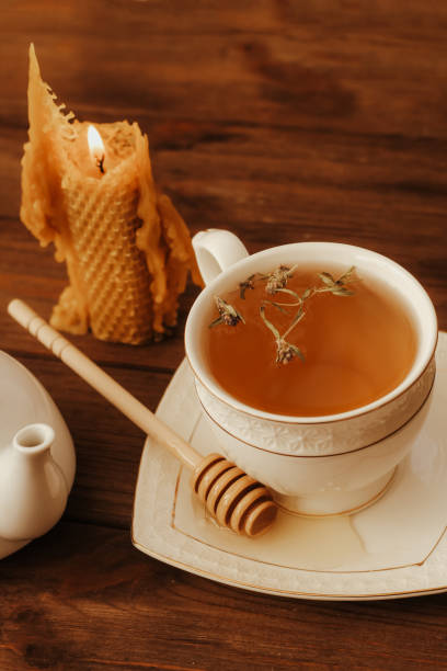 istock Herbal green tea in a white cup on the table 1495327185