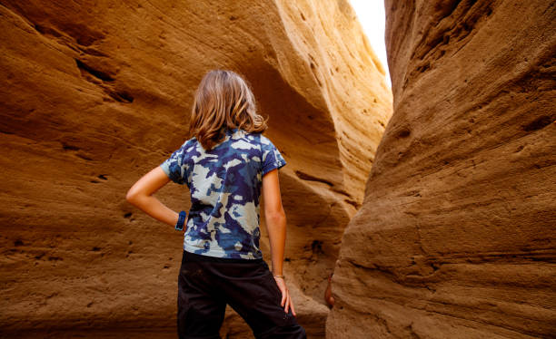 istock children in red canyon and sun light- Morocco 1495329972