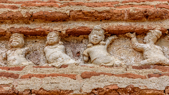Carving of anthropomorphic figures, maybe dancers, on the Abhayagiri indu temple, Anuradhapura, Sri Lanka