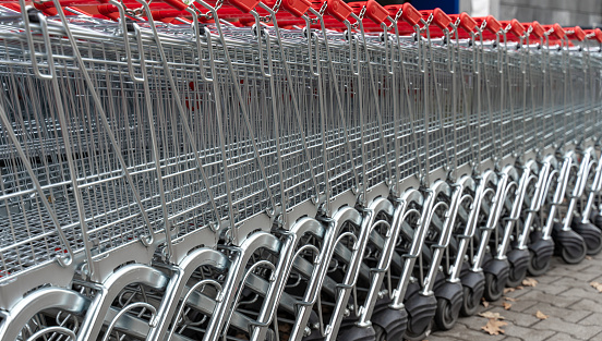 Close-up of parked shopping carts in a row, Berlin