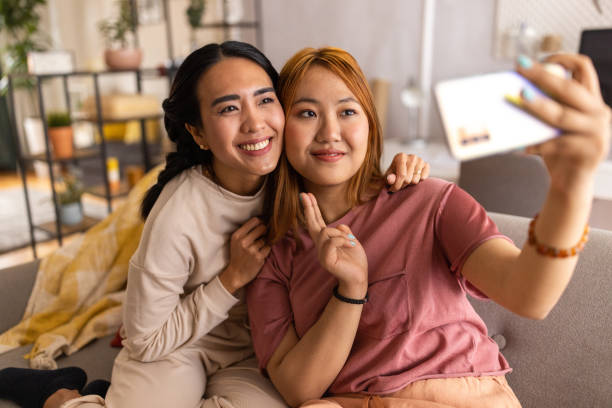 istock Two women taking a selfie at home 1495336814