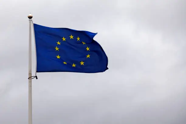 eu flag with disturbing gray sky