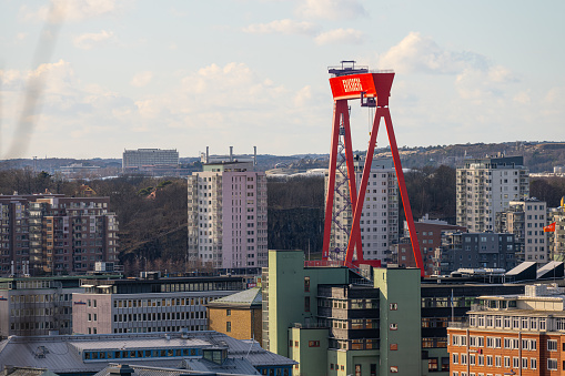 Gothenburg, Sweden - February 25 2023: View of Eriksberg gantry crane and tall apartment buildings.
