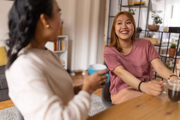 istock Two female friends drinking coffee together 1495338503