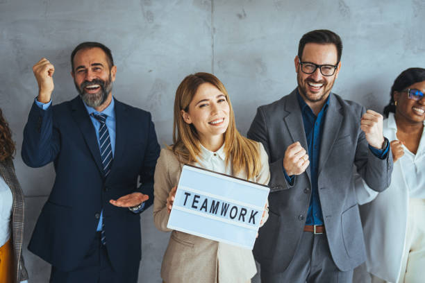 istock Multi-ethnic group of business persons standing side by side 1495338516