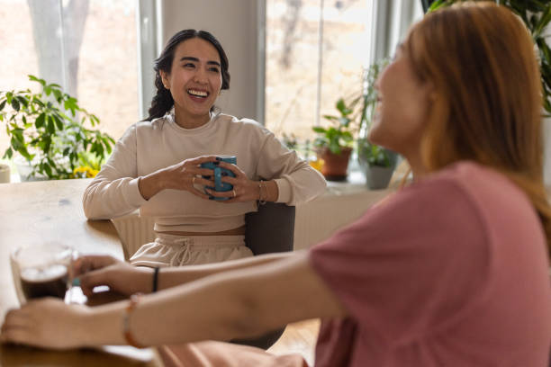 istock Two female friends drinking coffee together 1495338665