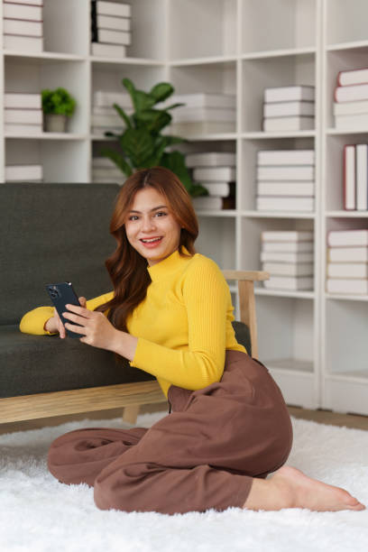 istock Attractive Asian woman resting comfortable living room and using mobile phone, Relax, Sofa, Lifestyle 1495341079