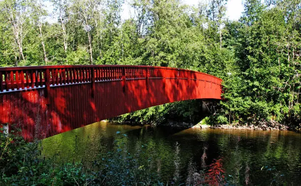 red bridge over a river at Umea