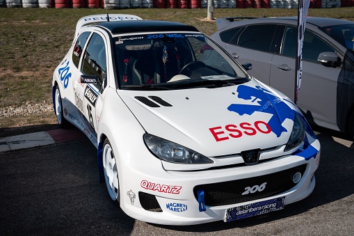 Los Arcos, Spain – February 25, 2023: Detail of the impressive Peugeot 206 WRC rally with the decoration and ESSO