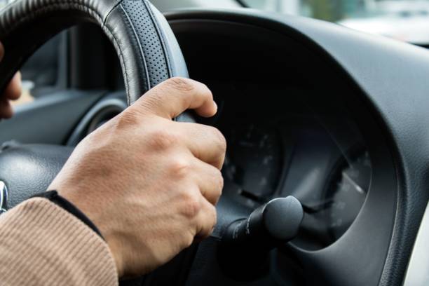 istock a person using the dashboard of a car on the road 1495345034