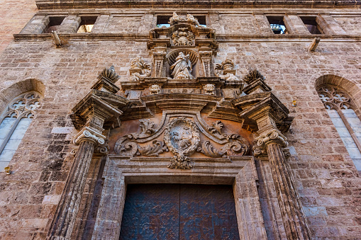 Intricacy and stone decoration in old Catholic Church in Valencia, Spain