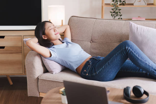istock Attractive Asian woman resting comfortable living room and using laptop computer, Relax, Sofa, Lifestyle 1495350450