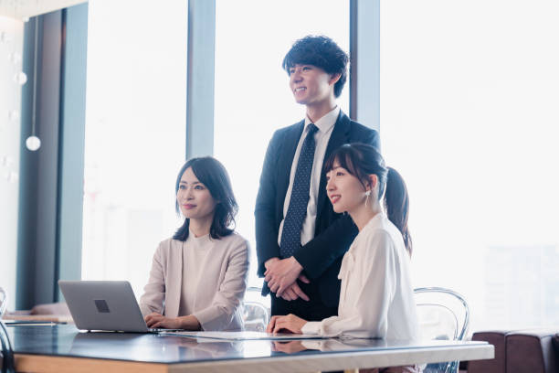 istock Business people sharing documents in an office 1495350599