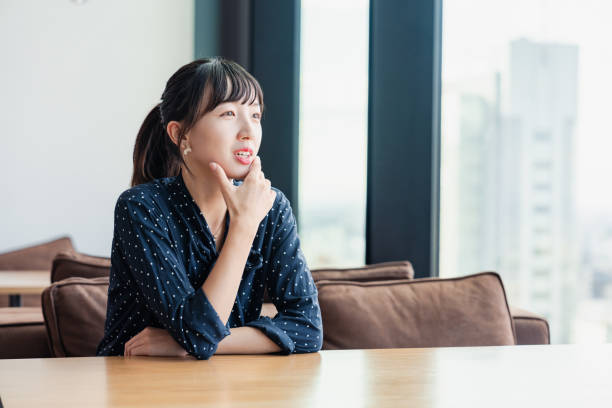 istock College student woman interning at the office 1495353948