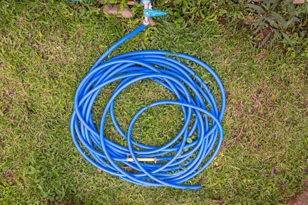 istock Garden hose on a lawn 1495353961