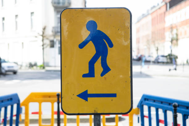 Sign directing pedestrians around roadworks in the City of Brussels