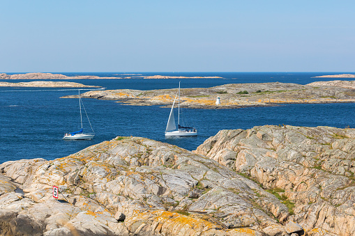 Sailing boats in rocky sea archipelago