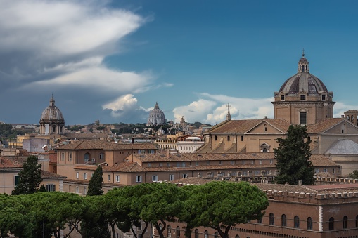 A scenic view of domes of old buildings in Piazza Venezia, Rome, Italy