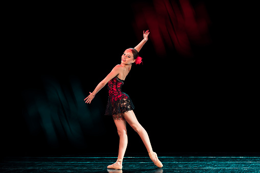 Young girl dancing freestyle ballet in Tango choreography