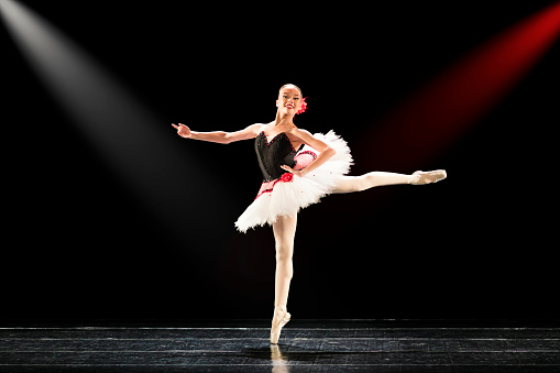 Young girl dancing Paquita Mazurka ballet variation on stage.