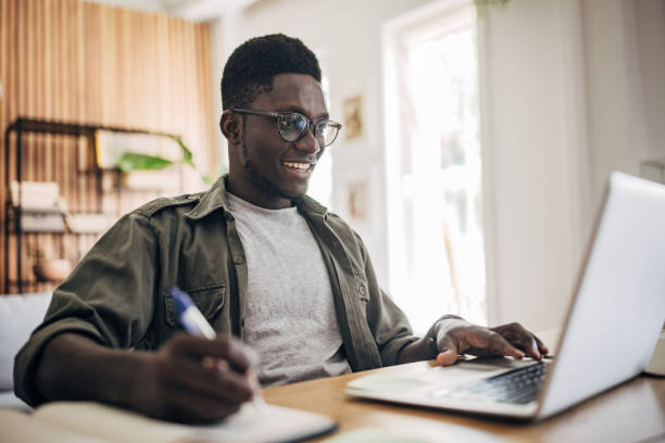 istock Man working on laptop at home 1495363056