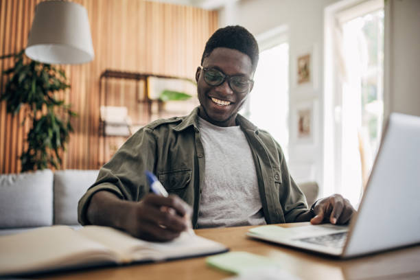 istock Man working on laptop at home 1495363109
