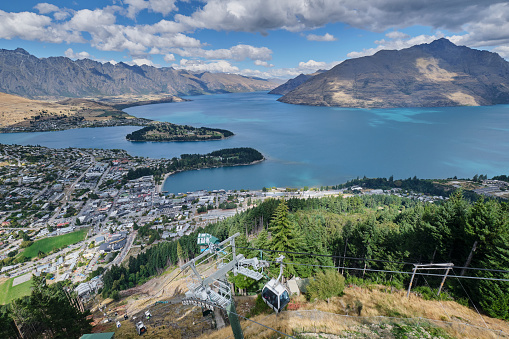 Looking down on Queenstown Bay Beach from Bob's Peak with skyline gondola , Lake Wakatipu and the Queenstown Wharf Area