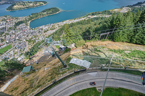 Looking down on Queenstown Bay Beach from Bob's Peak with skyline gondola, skyline luge, Lake Wakatipu and the Queenstown Wharf Area