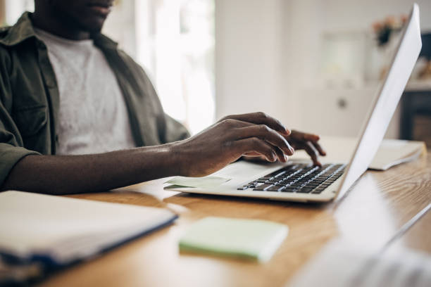 istock Man working on laptop at home 1495363154