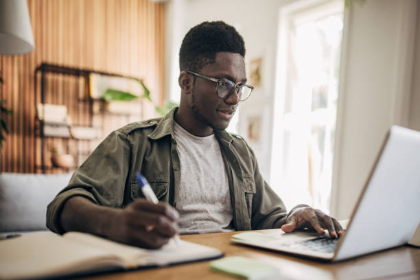 istock Man working on laptop at home 1495363207