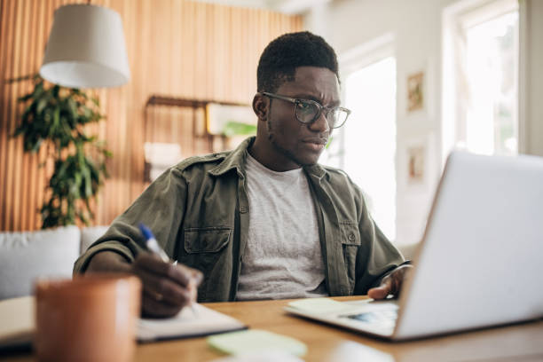 istock Man working on laptop at home 1495363252