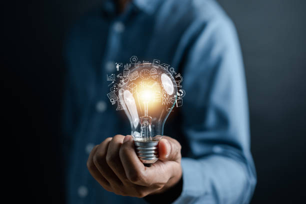 istock Businessman hand holding light bulb working Creativity, Creative for new idea and innovation with energy and power, growth and success development. 1495364147