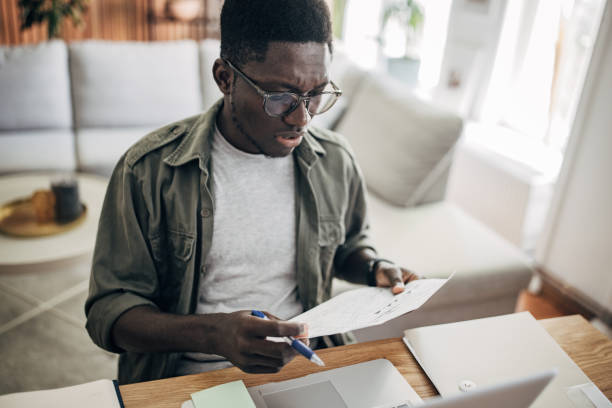 istock Man working on laptop at home 1495364157