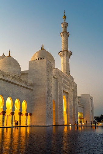 Abu Dhabi, United Arab Emirates – November 12, 2022: A portrait view of the  Abu Sheikh grand Mosque at sunset