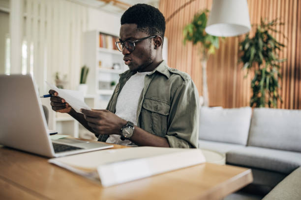 istock Man working on laptop at home 1495364365