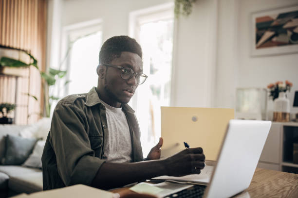 istock Man working on laptop at home 1495364559