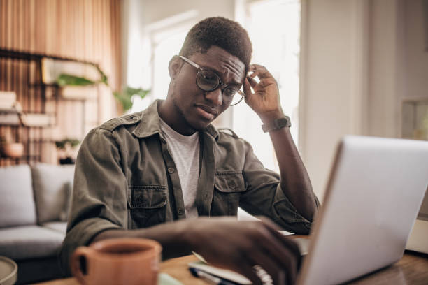 istock Man working on laptop at home 1495364882