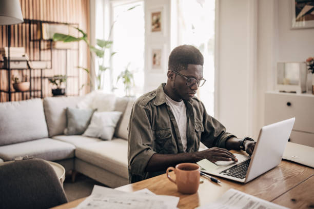 istock Man working on laptop at home 1495365049