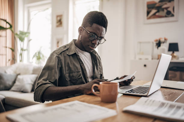 istock Man working on laptop at home 1495365102