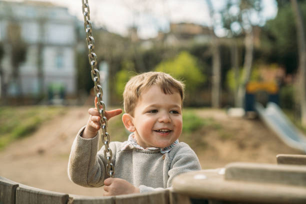 istock Kids playing in the park 1495365142