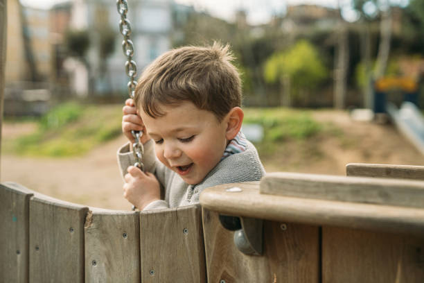 istock Kids playing in the park 1495365177