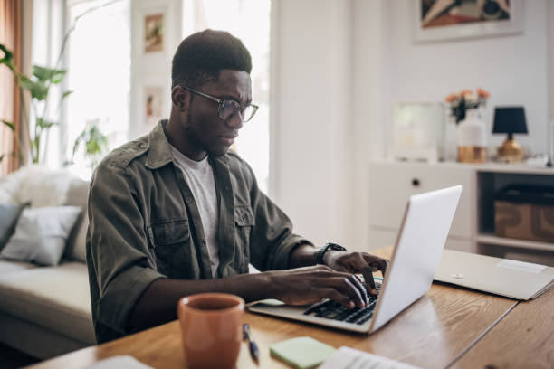 istock Man working on laptop at home 1495366512